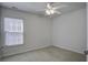 Cozy bedroom with a ceiling fan and large window bringing in natural light at 762 Redbud Ln, Summerville, SC 29486