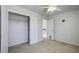 Bedroom featuring a closet with shelving, and doors leading to the hallway and staircase at 762 Redbud Ln, Summerville, SC 29486
