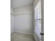 Walk-in closet featuring carpeted floor, white walls, wire shelving, and natural light from the window at 762 Redbud Ln, Summerville, SC 29486