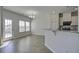 Bright dining area featuring stylish chandelier, window and access to backyard at 762 Redbud Ln, Summerville, SC 29486