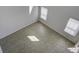 Bright, empty room with wood-look flooring and natural light coming through the windows at 762 Redbud Ln, Summerville, SC 29486