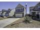 A well-maintained home showcasing a two-car garage, brick accents, and a well-manicured front lawn at 762 Redbud Ln, Summerville, SC 29486