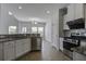 Bright kitchen showcasing stainless appliances, tile backsplash and granite countertops at 762 Redbud Ln, Summerville, SC 29486
