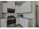 Bright kitchen with stainless steel appliances, range hood, and granite countertops at 762 Redbud Ln, Summerville, SC 29486