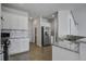 Bright kitchen showcasing stainless appliances, tile backsplash and granite countertops at 762 Redbud Ln, Summerville, SC 29486