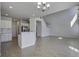Open-concept living room featuring wood floors, bar and stairs at 762 Redbud Ln, Summerville, SC 29486