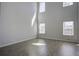 Bright living room featuring hardwood floors, high ceilings, and natural light from the windows at 762 Redbud Ln, Summerville, SC 29486