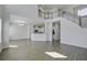 Spacious living room with hardwood floors, high ceilings and stairs leading to the second floor at 762 Redbud Ln, Summerville, SC 29486