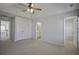 Main bedroom featuring a ceiling fan, two closets, and an ensuite bathroom at 762 Redbud Ln, Summerville, SC 29486