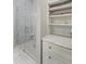 Elegant bathroom featuring a glass enclosed shower with marble tile and storage with marble top at 871 Center Park St, Charleston, SC 29492