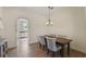 Elegant dining room featuring a wooden table, upholstered chairs and a view into the kitchen at 871 Center Park St, Charleston, SC 29492