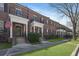 Charming brick townhomes featuring manicured lawns and inviting entrances on a sunny day at 871 Center Park St, Charleston, SC 29492
