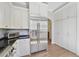 Well-equipped kitchen with stainless refrigerator, breakfast bar and plenty of storage at 871 Center Park St, Charleston, SC 29492