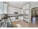 Modern kitchen featuring white cabinets, stainless steel appliances, and a stylish countertop at 871 Center Park St, Charleston, SC 29492