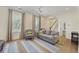 Bright living room with hardwood floors, neutral tones, and large windows offering natural light at 871 Center Park St, Charleston, SC 29492