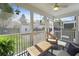 Relaxing screened-in porch with ceiling fan, comfortable seating and views of the backyard at 871 Center Park St, Charleston, SC 29492
