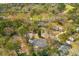 Expansive aerial shot of a neighborhood showcases the home's position among lush greenery and mature trees at 905 Battery Way, Mount Pleasant, SC 29464