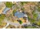 Stunning aerial view of the home nestled on a wooded lot with mature trees and a circular driveway at 905 Battery Way, Mount Pleasant, SC 29464