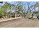 New wooden back deck with wood railing looking out to the back yard trees at 905 Battery Way, Mount Pleasant, SC 29464