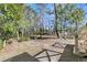Lush backyard with mature trees offering shade and privacy, next to wooden deck at 905 Battery Way, Mount Pleasant, SC 29464