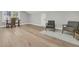 Spacious bedroom with two sitting chairs on a rug, hardwood floors and lots of natural light at 905 Battery Way, Mount Pleasant, SC 29464