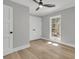 Bedroom with light hardwood floors, light grey walls and a scenic view outside at 905 Battery Way, Mount Pleasant, SC 29464