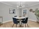 Cozy dining room with a round table, stylish chairs, and a modern chandelier at 905 Battery Way, Mount Pleasant, SC 29464