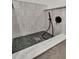 Close-up view of a stylish dog shower with modern fixtures and sleek tile at 905 Battery Way, Mount Pleasant, SC 29464
