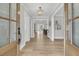 Inviting entryway featuring hardwood floors and an open view into the dining area at 905 Battery Way, Mount Pleasant, SC 29464