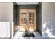 Elegant double front door with glass panels and dark trim, offering a grand entrance at 905 Battery Way, Mount Pleasant, SC 29464