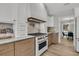 Modern kitchen features white cabinets, a gas range stove, and stainless steel appliances at 905 Battery Way, Mount Pleasant, SC 29464