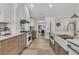Bright kitchen features a gas stove, wooden cabinets, and an open floorplan at 905 Battery Way, Mount Pleasant, SC 29464