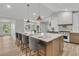 Bright kitchen island with seating, pendant lights, and marble countertops at 905 Battery Way, Mount Pleasant, SC 29464