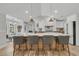 Spacious kitchen island with seating, pendant lighting, and modern finishes at 905 Battery Way, Mount Pleasant, SC 29464