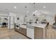 Open concept kitchen with large island, barstool seating and modern appliances at 905 Battery Way, Mount Pleasant, SC 29464