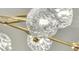 Close-up of a contemporary light fixture with crystal orbs and gold accents at 905 Battery Way, Mount Pleasant, SC 29464