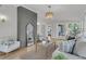 This bright living room features a cozy sofa and neutral colors with a stylish mirror at 905 Battery Way, Mount Pleasant, SC 29464