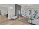 Bright and airy living room with hardwood floors and a peek into another room at 905 Battery Way, Mount Pleasant, SC 29464