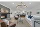 Open concept living space with fireplace, adjacent to a modern kitchen at 905 Battery Way, Mount Pleasant, SC 29464