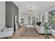Bright living room with neutral furniture, hardwood floors, and windows offering a lot of natural light at 905 Battery Way, Mount Pleasant, SC 29464