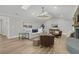 Spacious living room with ample seating, a statement chandelier, and neutral decor at 905 Battery Way, Mount Pleasant, SC 29464