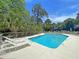 Large community pool with plenty of lounging chairs surrounded by trees at 905 Battery Way, Mount Pleasant, SC 29464