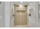 Luxurious walk-in shower with dual shower heads and tiled surround with built-in storage niche at 905 Battery Way, Mount Pleasant, SC 29464
