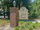 Elegant community entrance sign with brick pillar and manicured landscaping at 905 Battery Way, Mount Pleasant, SC 29464