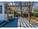 Covered back deck with seating, offering shade and an entertaining space in the backyard at 960 Mooring Dr, Charleston, SC 29412