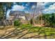 Fenced backyard with green grass, mature trees, and a privacy fence at 960 Mooring Dr, Charleston, SC 29412