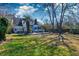 Spacious backyard with a deck, pergola, mature trees, and well-maintained lawn perfect for outdoor activities at 960 Mooring Dr, Charleston, SC 29412