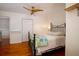 Bedroom with gleaming hardwood floors and a classic iron bed frame at 960 Mooring Dr, Charleston, SC 29412
