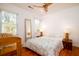 Sunlit bedroom featuring hardwood floors, a ceiling fan, and ample natural light at 960 Mooring Dr, Charleston, SC 29412