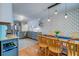 Bright dining area with updated fixtures, wood floors and a view to the kitchen at 960 Mooring Dr, Charleston, SC 29412